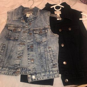 Two denim vests- one black and one blue denim.
